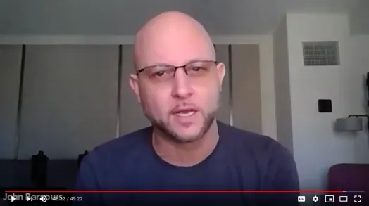 Video: a still from the webinar recording showing panelist John Barrows speaking to camera