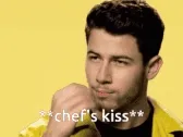Animated GIF of a person making a chef's kiss gesture, captioned chef's kiss